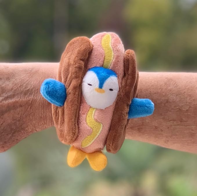 Adorable Penguin in a Hot Dog Costume Slap Bracelet. This cuddly friend easily wraps around your wrist, backpack, bedpost, or any object that fits its soft and snug embrace, PT101
