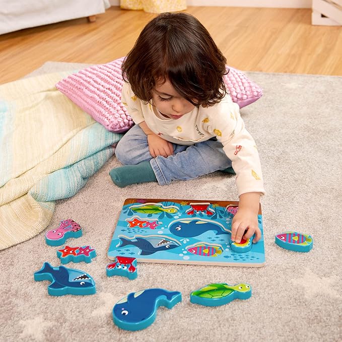 B. toys- Peek & Explore 4-Pack: Bus, Sea, Space, Dino- Chunky Puzzle 4-Pack – Wooden Puzzles – Sea, Space, Bus, Dinos – 8 Pieces Each – 2 Years +