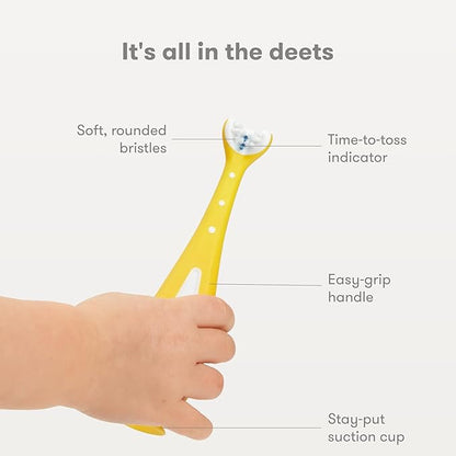 Frida Baby Training Toothbrush | Toddler Toothbrush for 18-24 Months, Easy-Grip Handle, Triple Angle Bristles, Soft Toothbrush Bristles, Stay-Put Suction Cup | Yellow