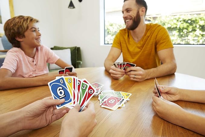 Mattel Games UNO Card Game for Family Night with Cards Specially Designed for Left-Handed Players in Collectible Tin Box