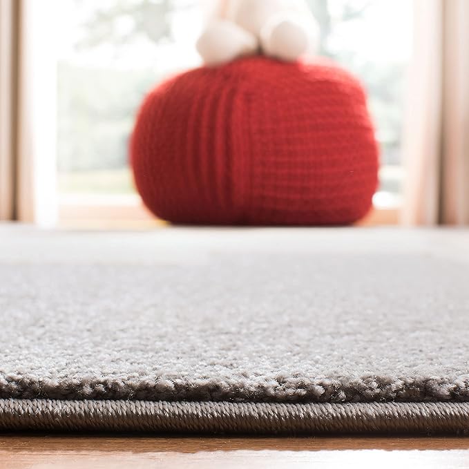 SAFAVIEH Carousel Kids Collection Area Rug - 6'7" x 9', Grey & Ivory, Elephant Design, Non-Shedding & Easy Care, Ideal for High Traffic Areas for Boys & Girls in Playroom, Nursery, Bedroom (CRK165B)