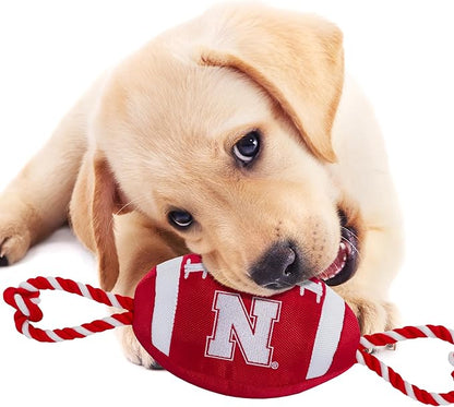 Pets First NCAA Nebraska Cornhuskers Football Dog Toy, Tough Quality Nylon Materials, Strong Pull Ropes, Inner Squeaker, Collegiate Team Color