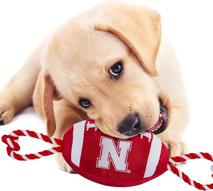 Pets First NCAA Nebraska Cornhuskers Football Dog Toy, Tough Quality Nylon Materials, Strong Pull Ropes, Inner Squeaker, Collegiate Team Color