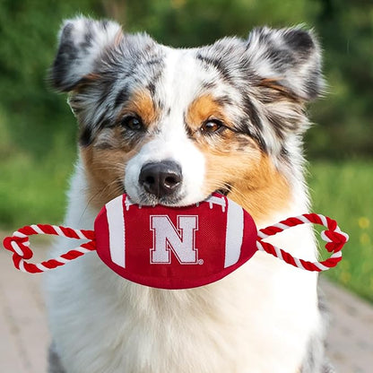 Pets First NCAA Nebraska Cornhuskers Football Dog Toy, Tough Quality Nylon Materials, Strong Pull Ropes, Inner Squeaker, Collegiate Team Color