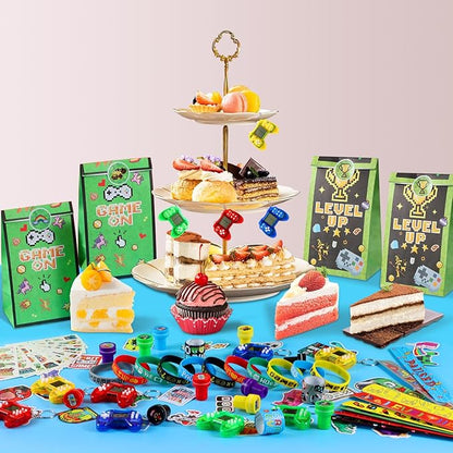 LiYiQ 122 Pcs Video Game Party Favors With Video Game Keychains Slap Bracelets Temporary Tattoos Silicone Wristband Gift Tags Stamps Stickers and Gift Bags for Gamer Birthday Party Supplies
