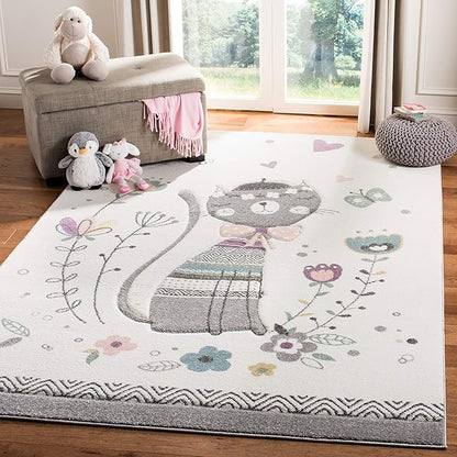 SAFAVIEH Carousel Kids Collection Area Rug - 9' x 12', Ivory & Pink, Cat Design, Non-Shedding & Easy Care, Ideal for High Traffic Areas for Boys & Girls in Playroom, Nursery, Bedroom (CRK187A)
